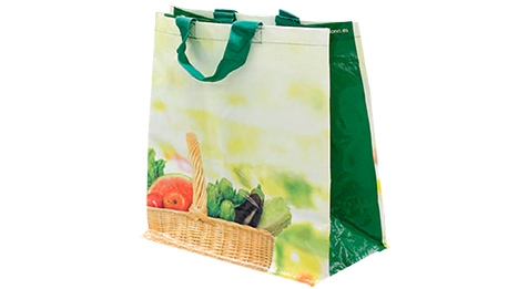 Imatge de la bossa de roba de Mercadona. Porta estampada una cistella plena de verdures: albergínies, tomaques, enciams